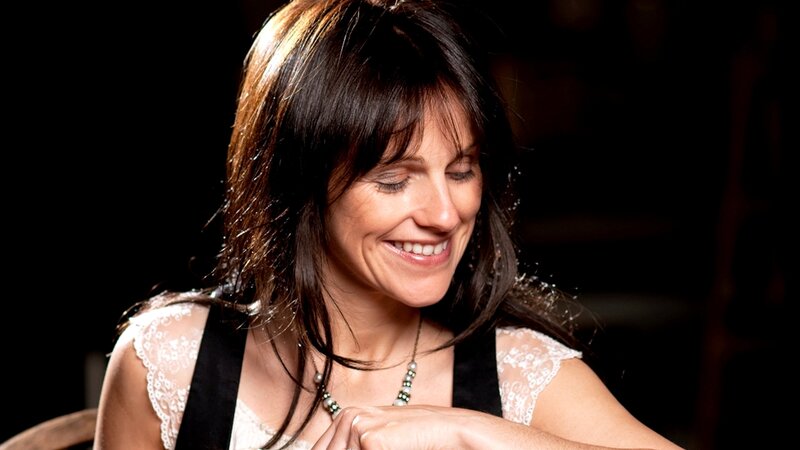 woman smiling with eyes closed