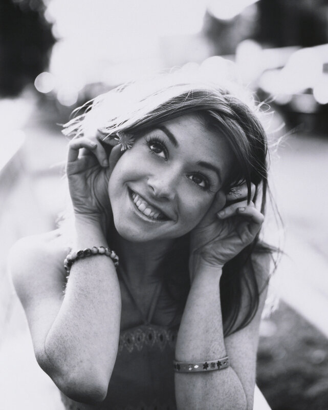 woman smiling with flower