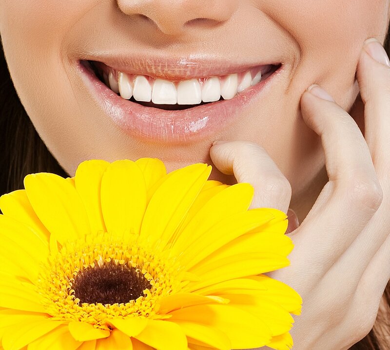Woman Smiling with Flower — Yellow