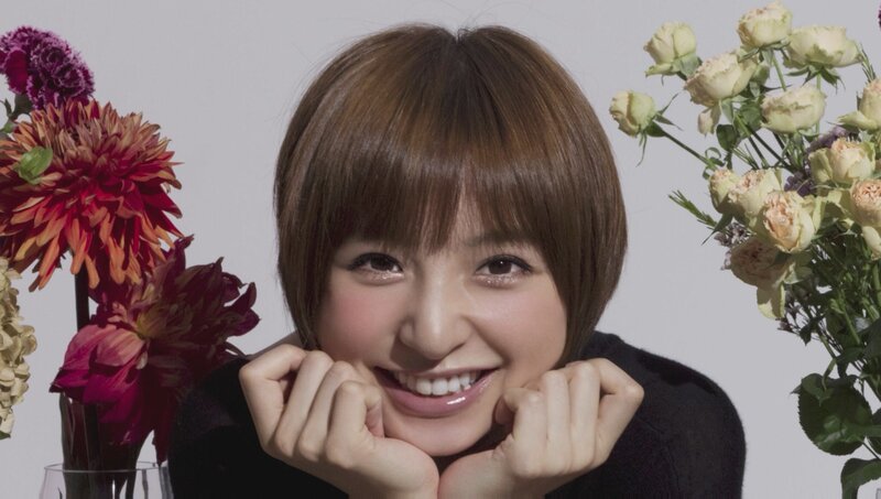 woman smiling with flowers