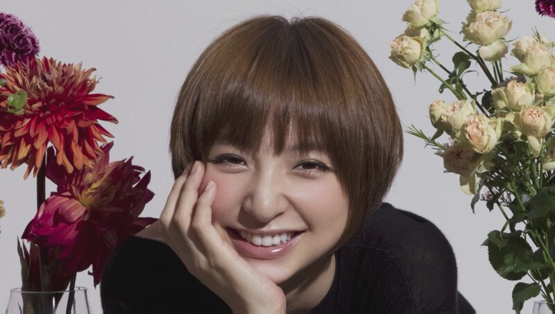 woman smiling with flowers
