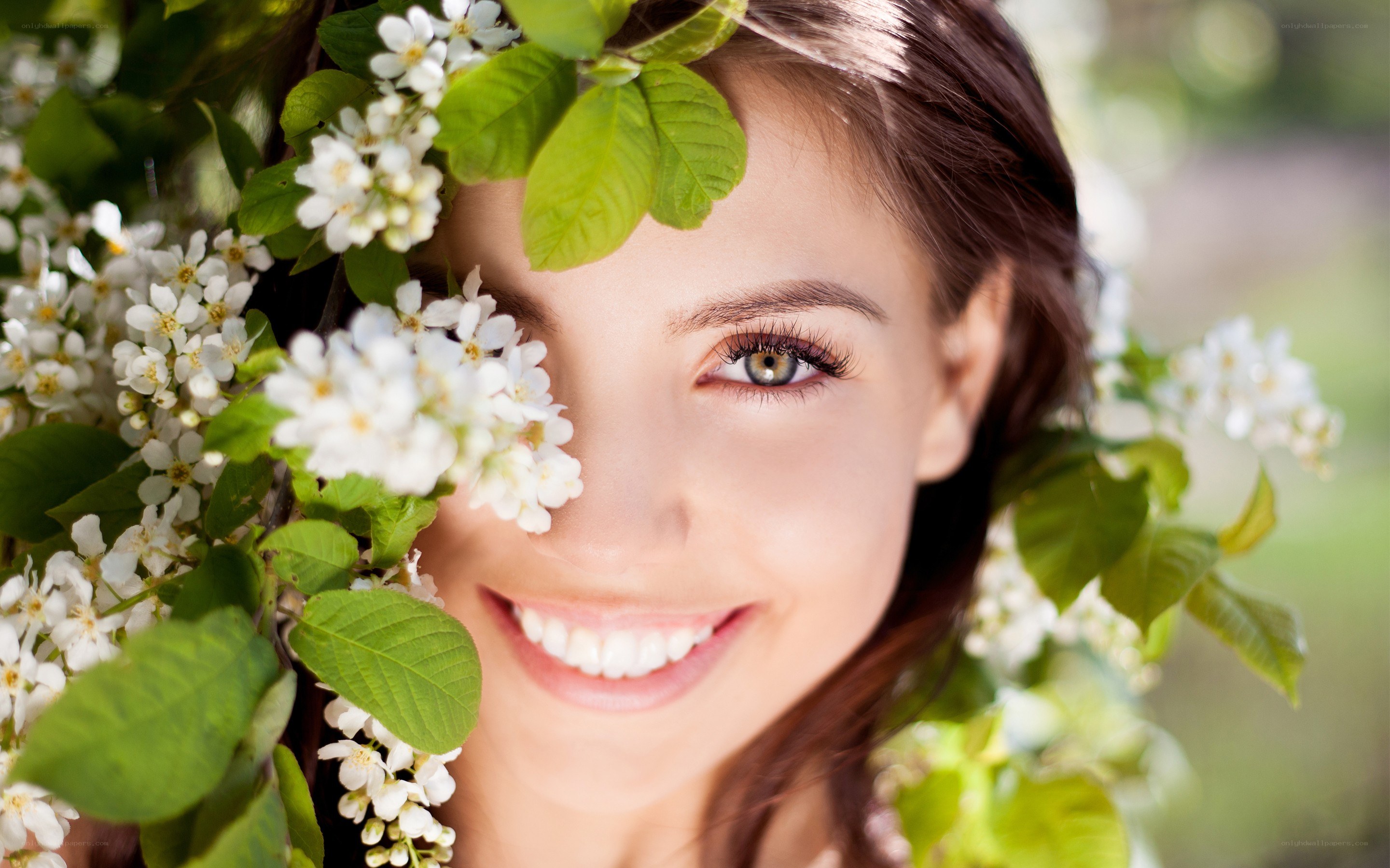 woman smiling with flowers