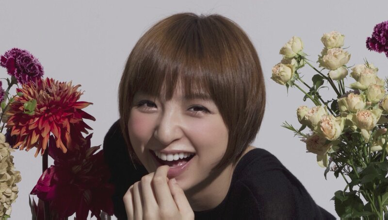 woman smiling with flowers