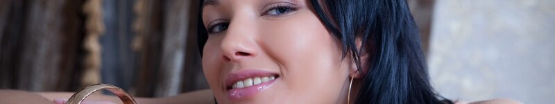 woman smiling with gold bracelet