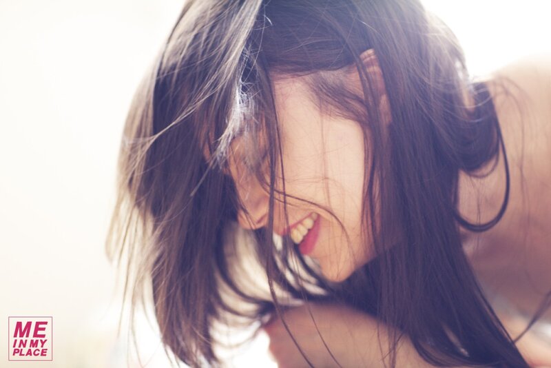 woman smiling with hair in face