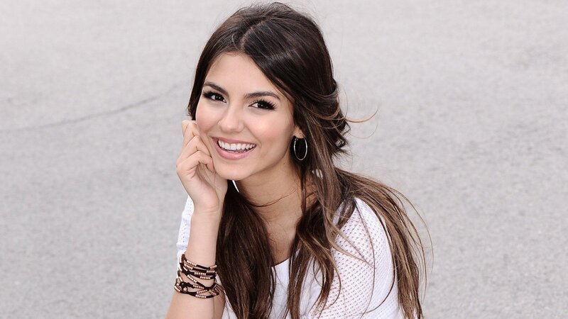 woman smiling with hand on cheek