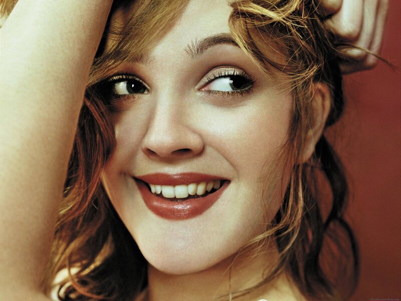 woman smiling with hand on head
