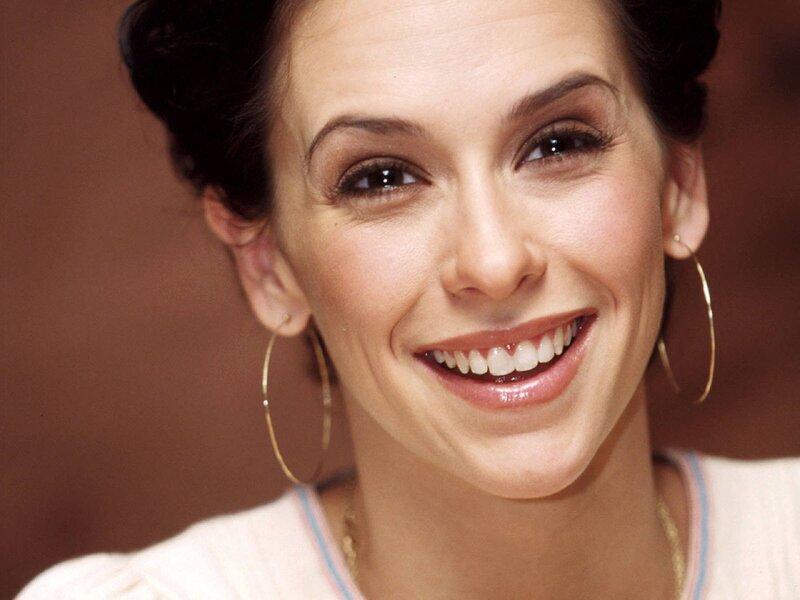 woman smiling with hoop earrings