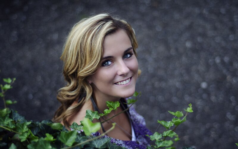 woman smiling with ivy
