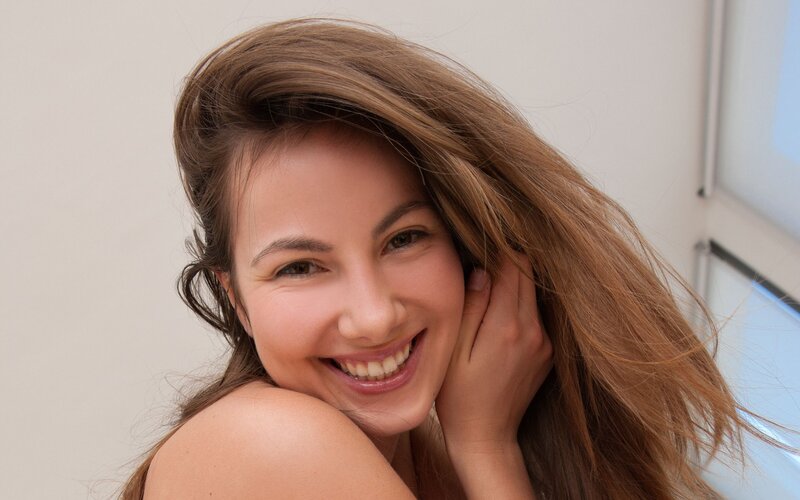 woman smiling with long hair