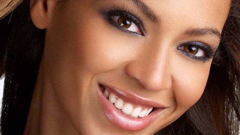 woman smiling with makeup