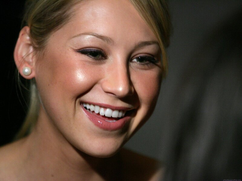 woman smiling with pearl earring
