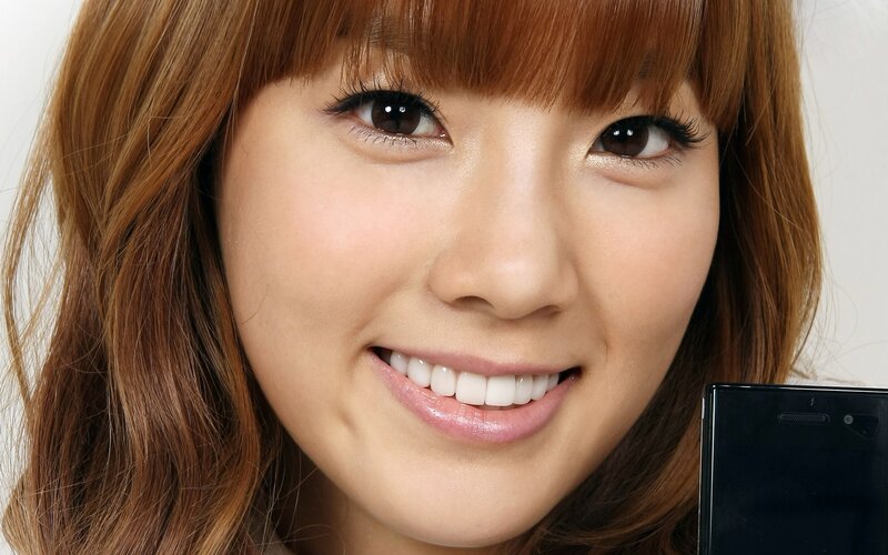 woman smiling with phone