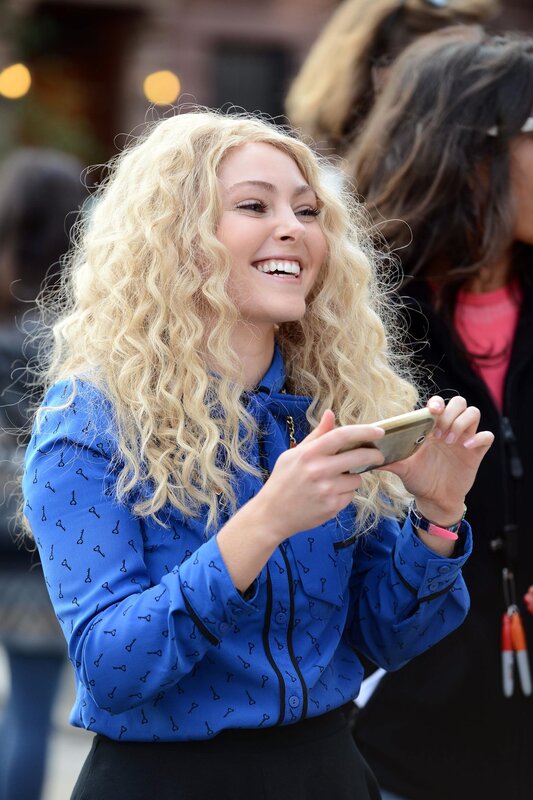 woman smiling with phone