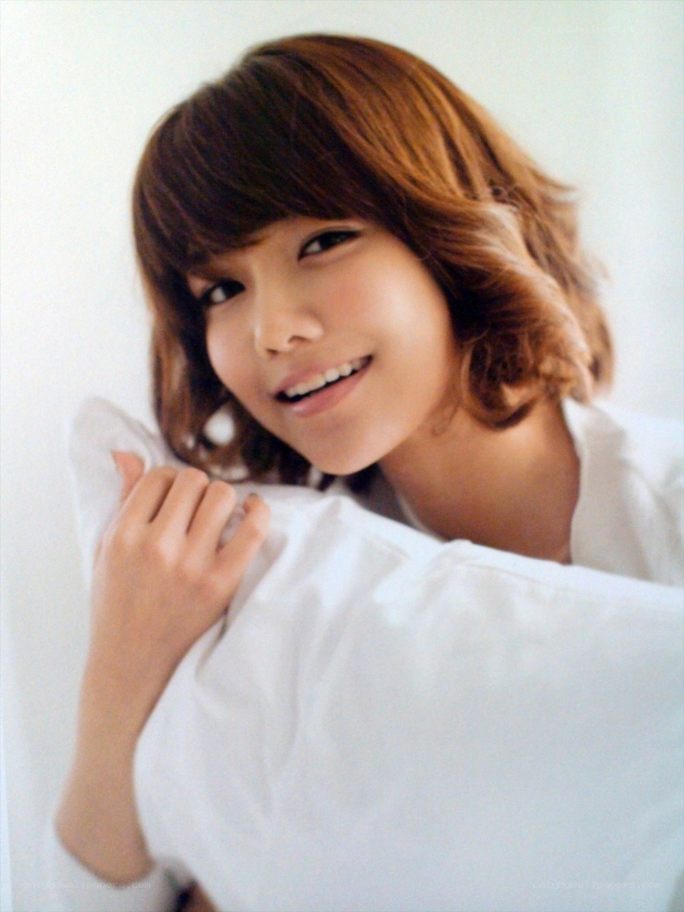 woman smiling with pillow