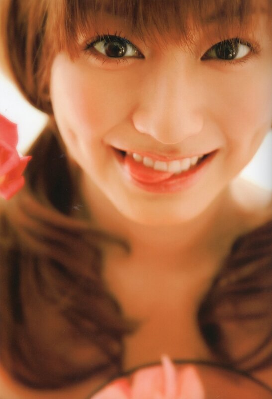woman smiling with rose