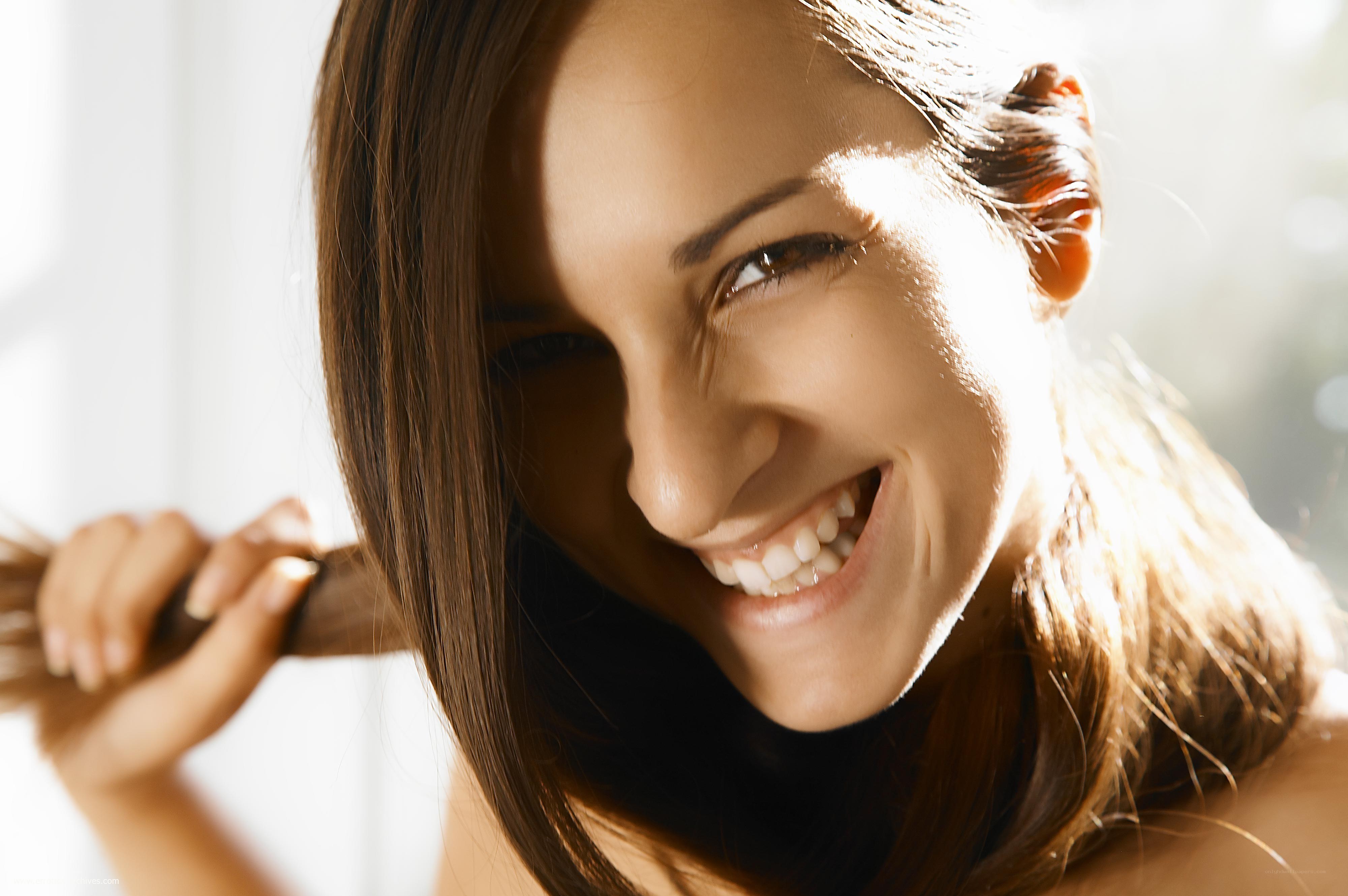 woman smiling with sunlight