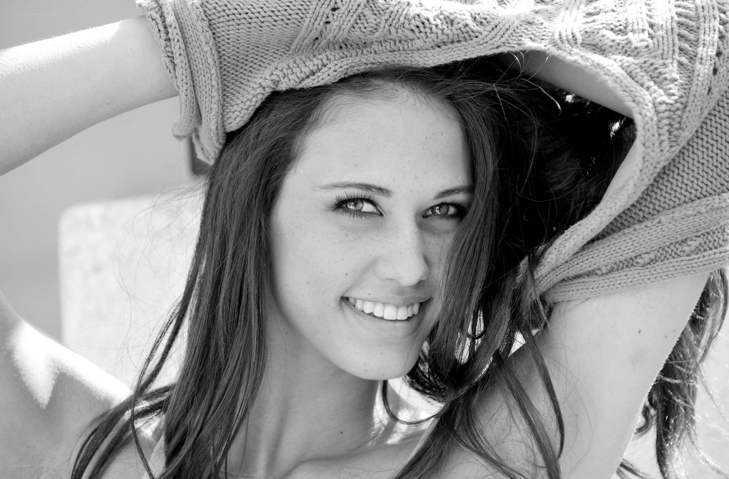 woman smiling with sweater