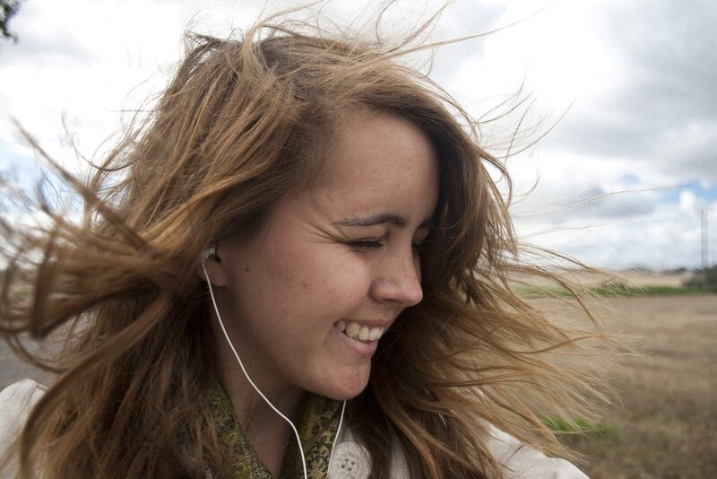 woman smiling with wind-blown hair