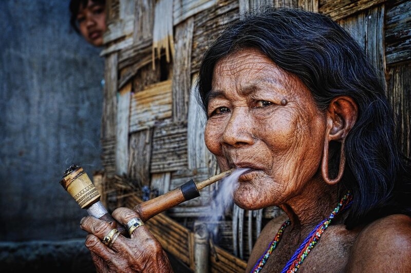 Woman smoking a pipe