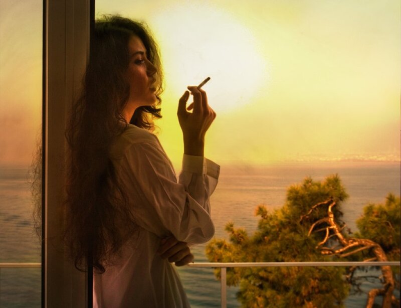 Woman Smoking at Balcony