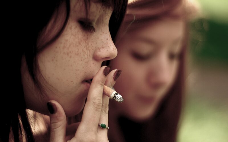 woman smoking cigarette