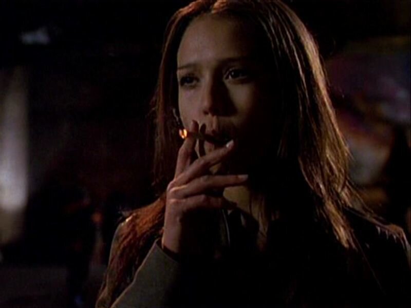 Woman Smoking Cigarette — Brown