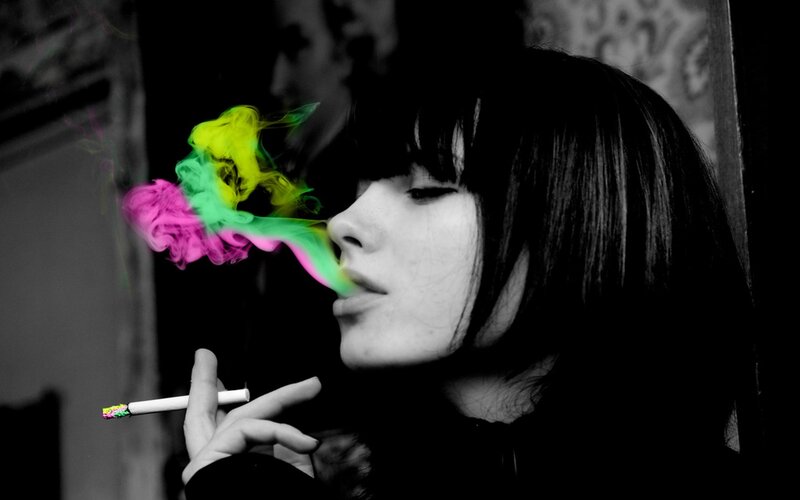 woman smoking colorful smoke