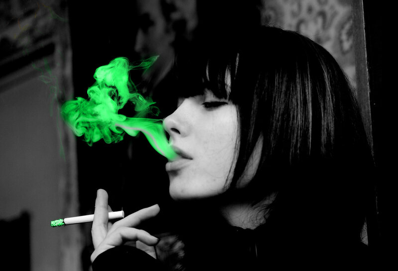 woman smoking green smoke
