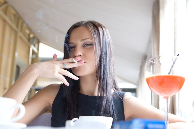 woman smoking in a cafe