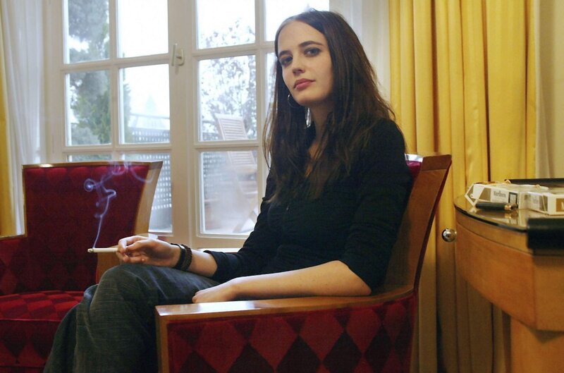 woman smoking in a chair