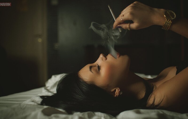 woman smoking in bed