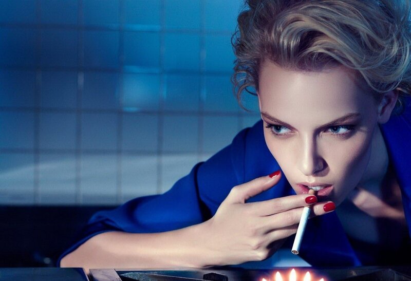 woman smoking in blue room