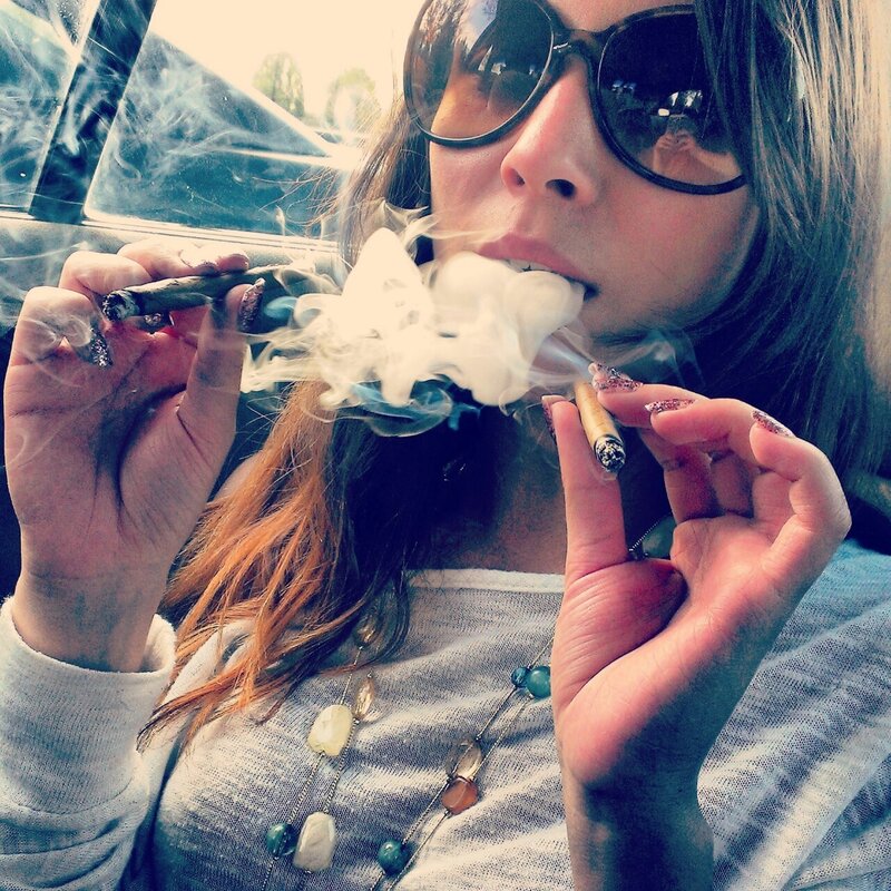 woman smoking in car