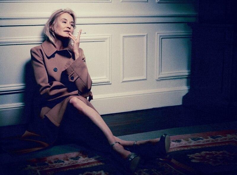 woman smoking in coat