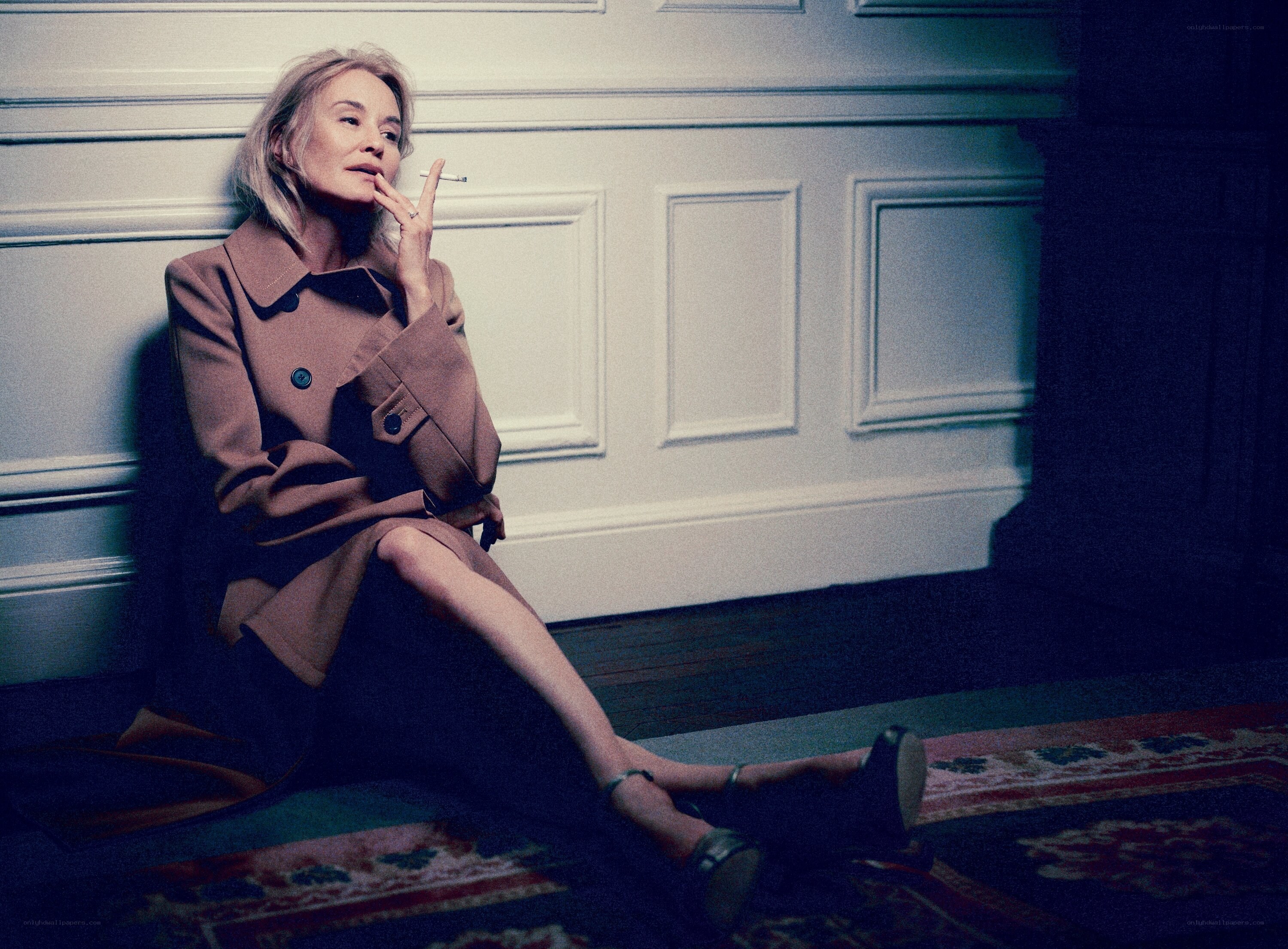 woman smoking in coat
