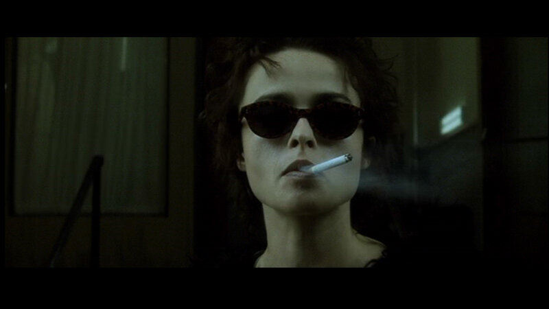 woman smoking in dark room