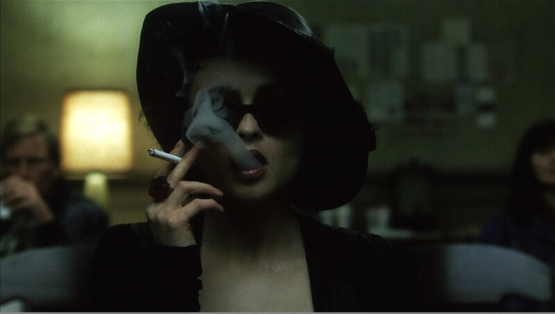 woman smoking in dark room