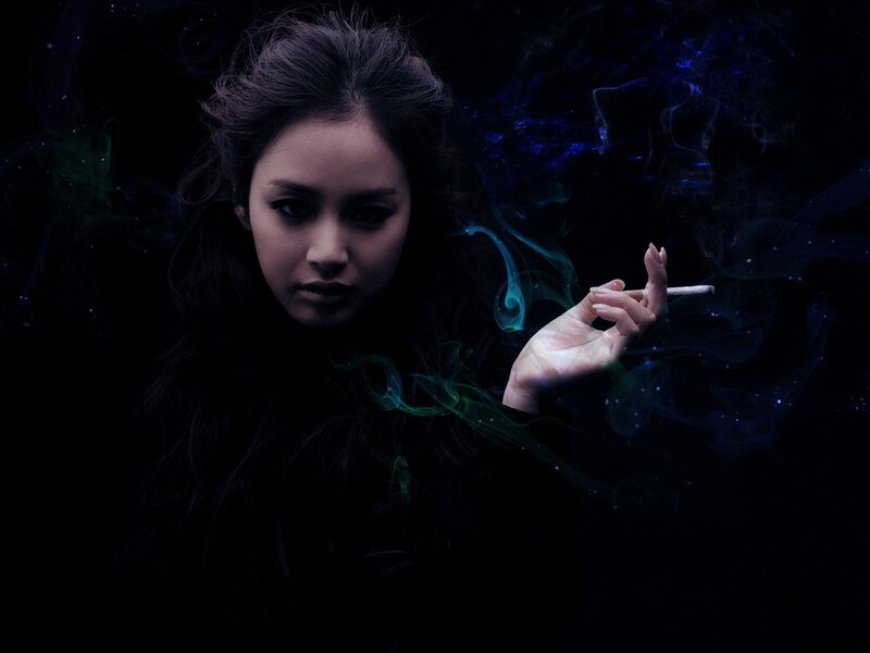 woman smoking in dark with smoke effects