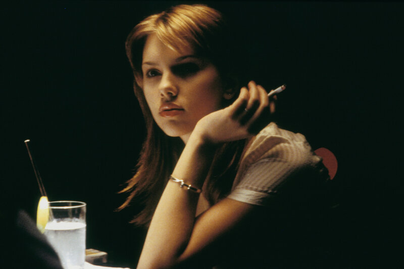 woman smoking in dim light