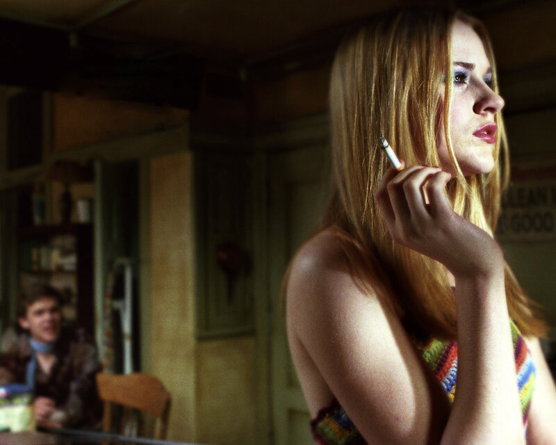 woman smoking in dim room