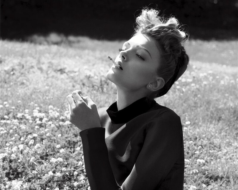Woman Smoking in Field