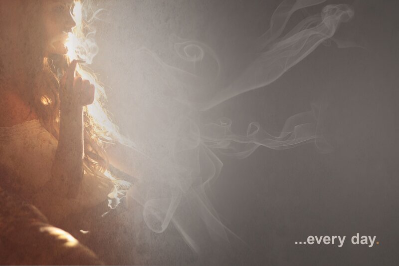 woman smoking in golden light