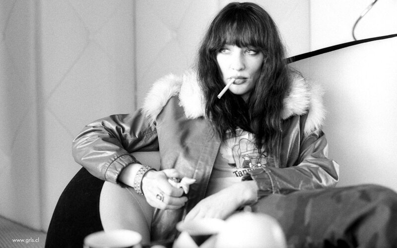 woman smoking in leather jacket