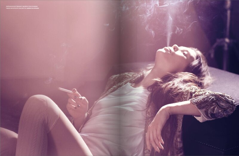 woman smoking in pink light
