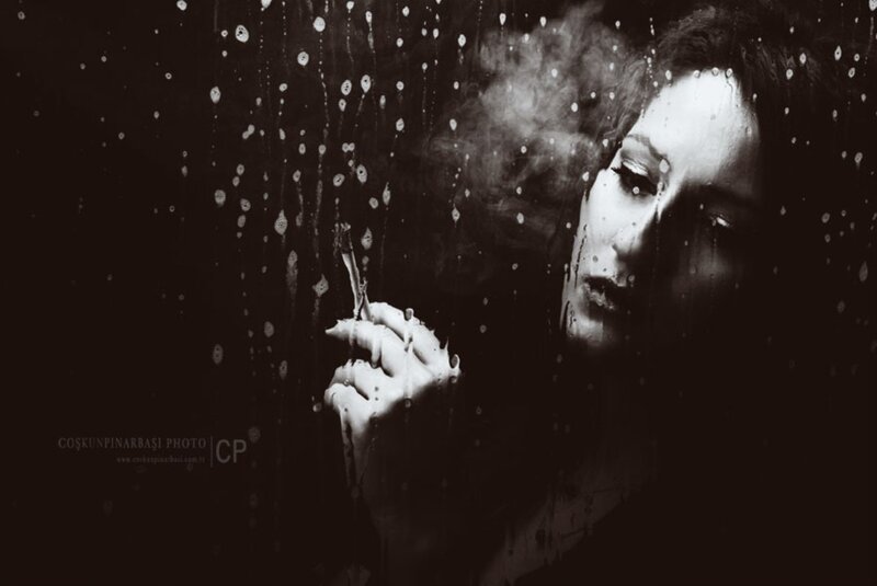 Woman Smoking in Rain