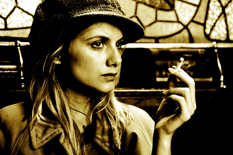woman smoking in sepia