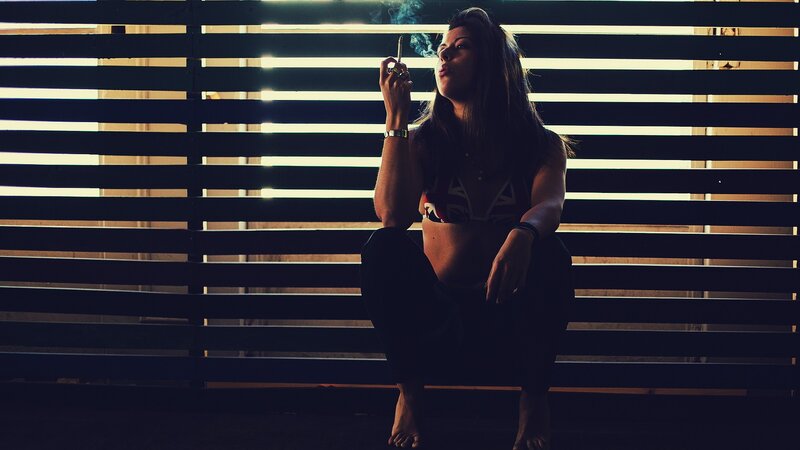 woman smoking in silhouette