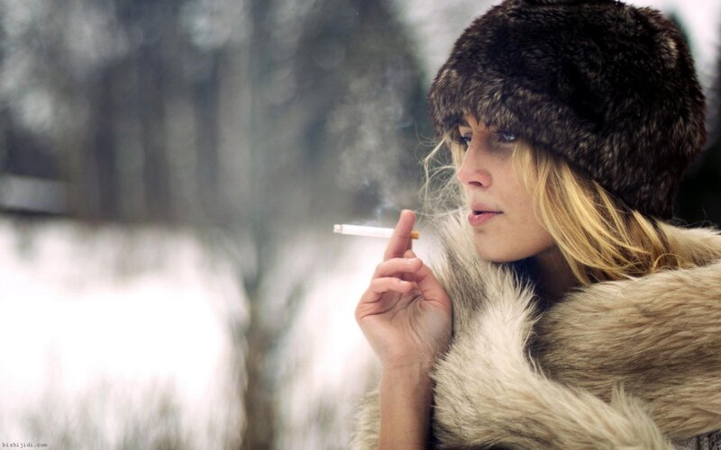 woman smoking in winter