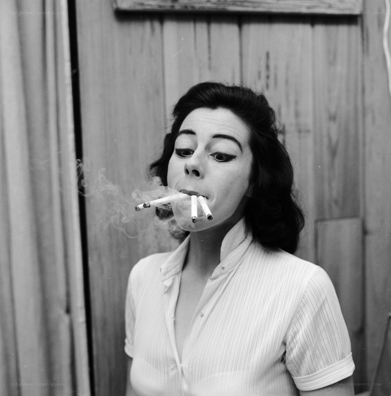 Woman smoking multiple cigarettes